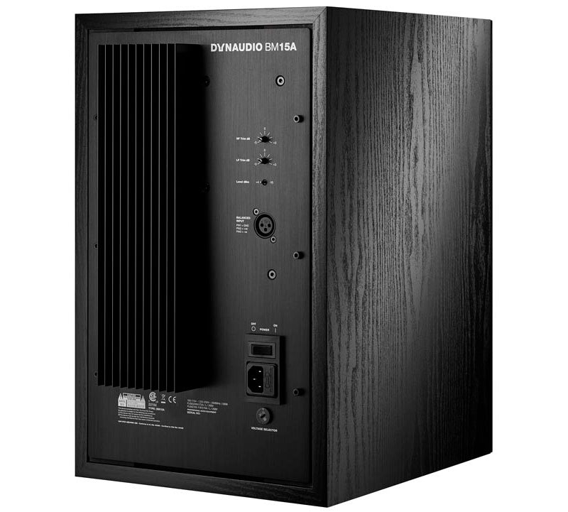 Dynaudio BM15A Active Studio Monitors, back view. Displays the power amplifier's heat sink and control panel, featuring a sensitivity switch and a set of filters for high-pass, mid-range, and low-frequency adjustments, along with a balanced XLR input.