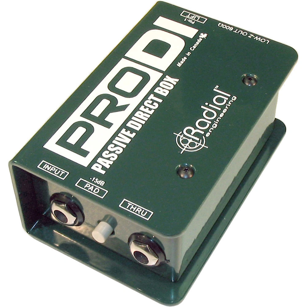 Radial Engineering ProDI Passive DI Box, angled top view. Shows robust steel chassis with 1/4" input and thru jacks, and an XLR output connector, featuring a ground lift switch and a-15db pad for reliable direct injection.