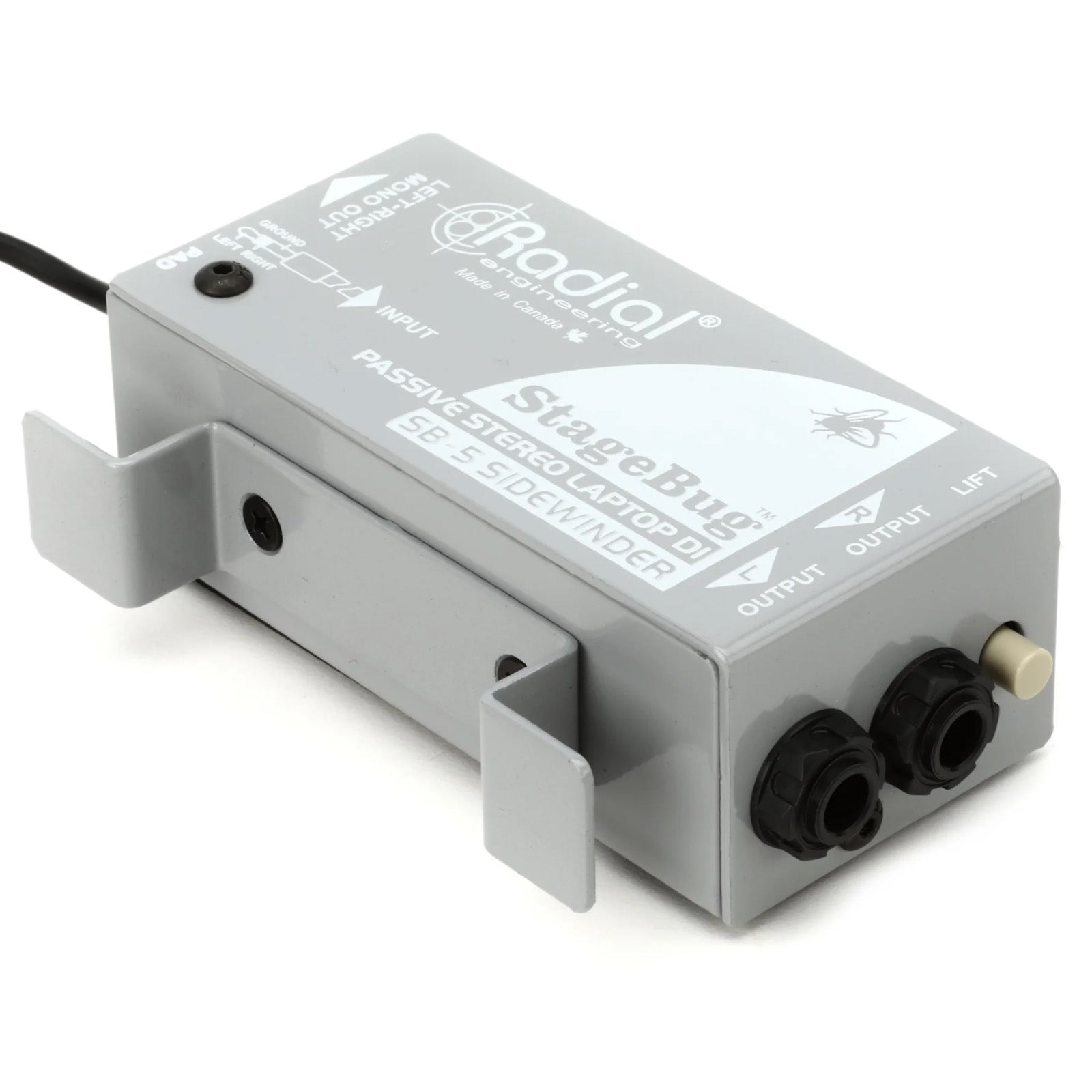 Radial StageBug SB-5 Stereo Laptop DI, side view. Features a compact design with a hardwired 3.5mm stereo input cable with a cable cleat for storage, stereo output with a mono output jack, a -15dB pad and ground lift switch, for connecting laptops and mobile devices to a PA system.