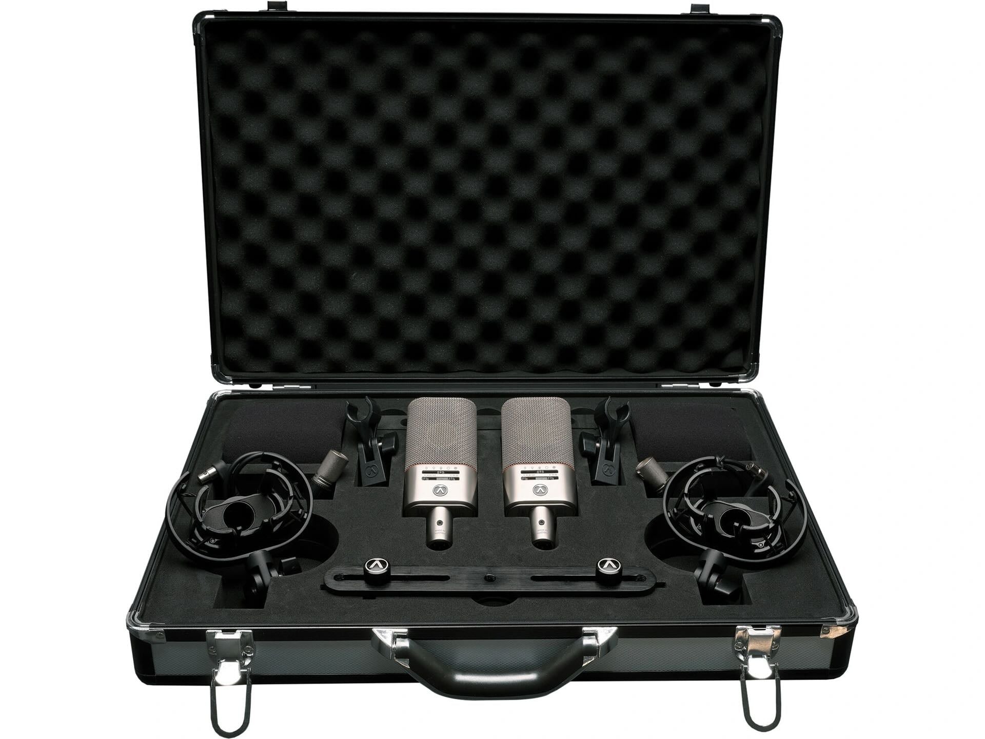 Austrian Audio OC818 Dual Set Plus Large-Diaphragm Multipattern Condenser Microphone Pair Silver in their custom carry case, showcasing two OC818 microphones, shock mounts, mini-XLR cables, stereo bar, and other essential accessories neatly arranged.