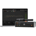 IK Multimedia ARC Studio Advanced Room Correction System promo, showing the ARC Studio hardware unit, the measurement microphone, and a laptop screen displaying the ARC software interface with room correction graphs.