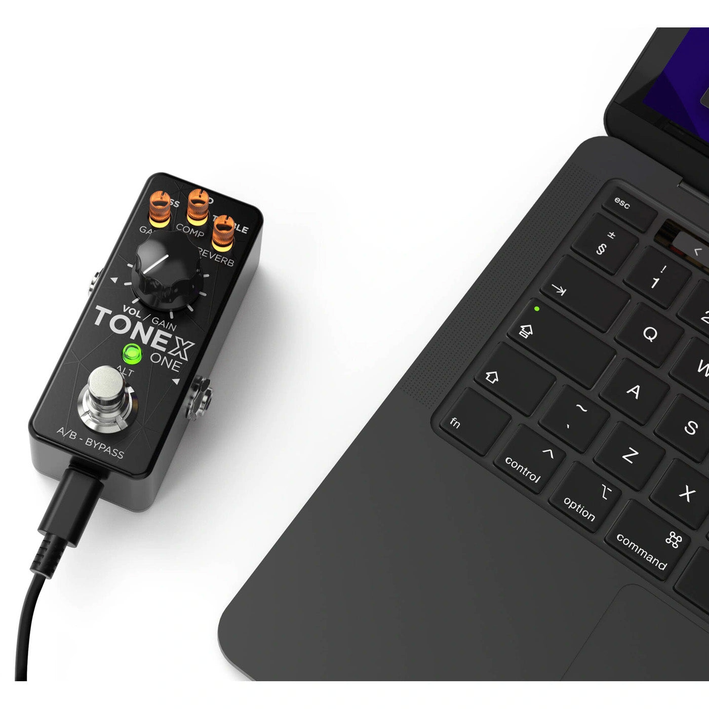 IK Multimedia TONEX ONE AI Modeling Multi-FX Pedal top view plugged into a computer, displaying its footswitch, three eq control knobs, gain knob, and LED indicator lights.