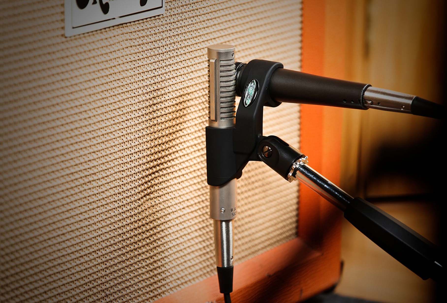 Royer AxeMount SM-21-57 R-121 dual microphone mount in use, positioning a Shure SM57 and Royer R-121 to mic a guitar amplifier speaker for blended tone.