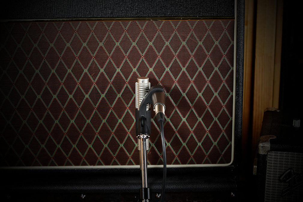 Royer AxeMount SM-21-57 R-121 dual microphone mount in use, rear view positioning a Shure SM57 and Royer R-121 to mic a guitar amplifier speaker for blended tone.