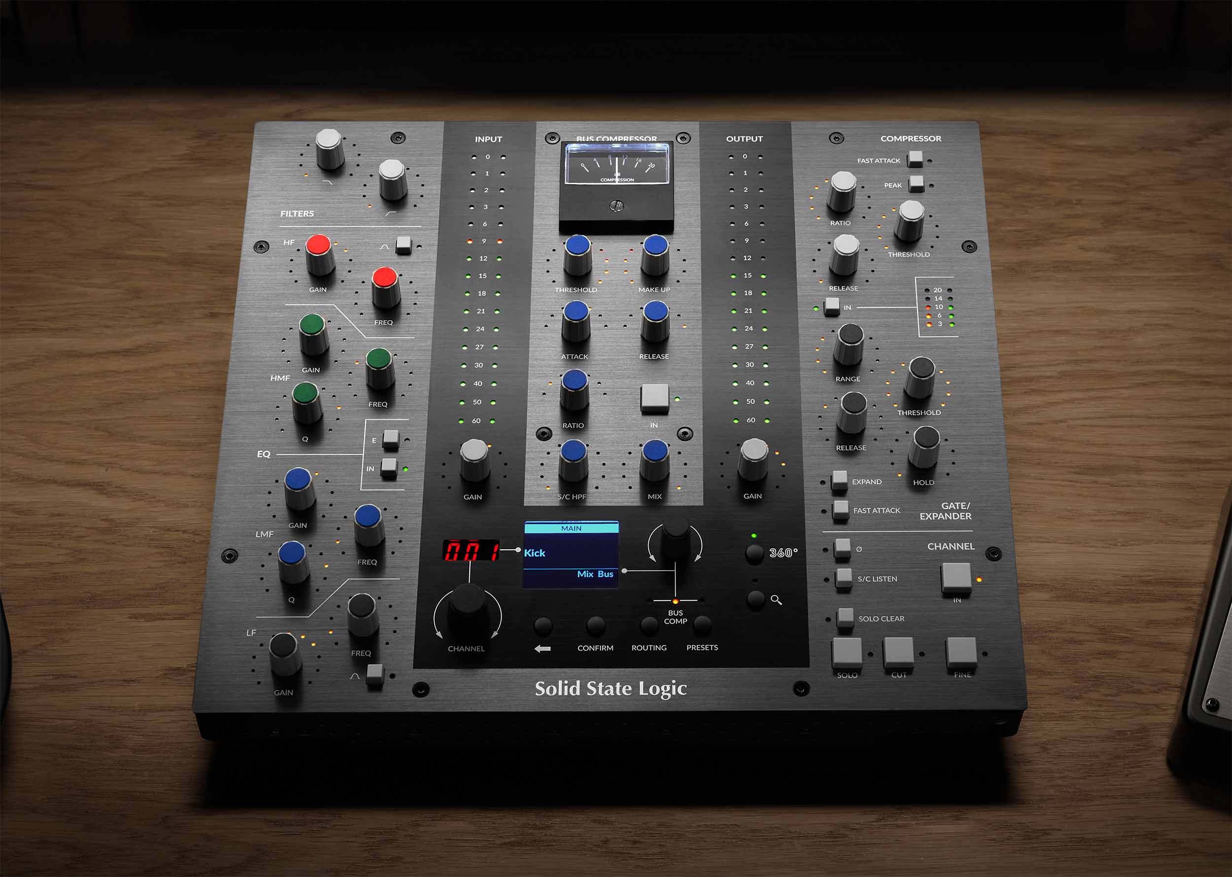 Solid State Logic UC1 Advanced Plug-in Controller promo, showcasing its dedicated console-style layout with a prominent central display, clearly laid out sections for SSL's Channel Strip and Bus Compressor plug-ins, including numerous rotary encoders and switches for EQ, dynamics, and a dedicated gain reduction meter.