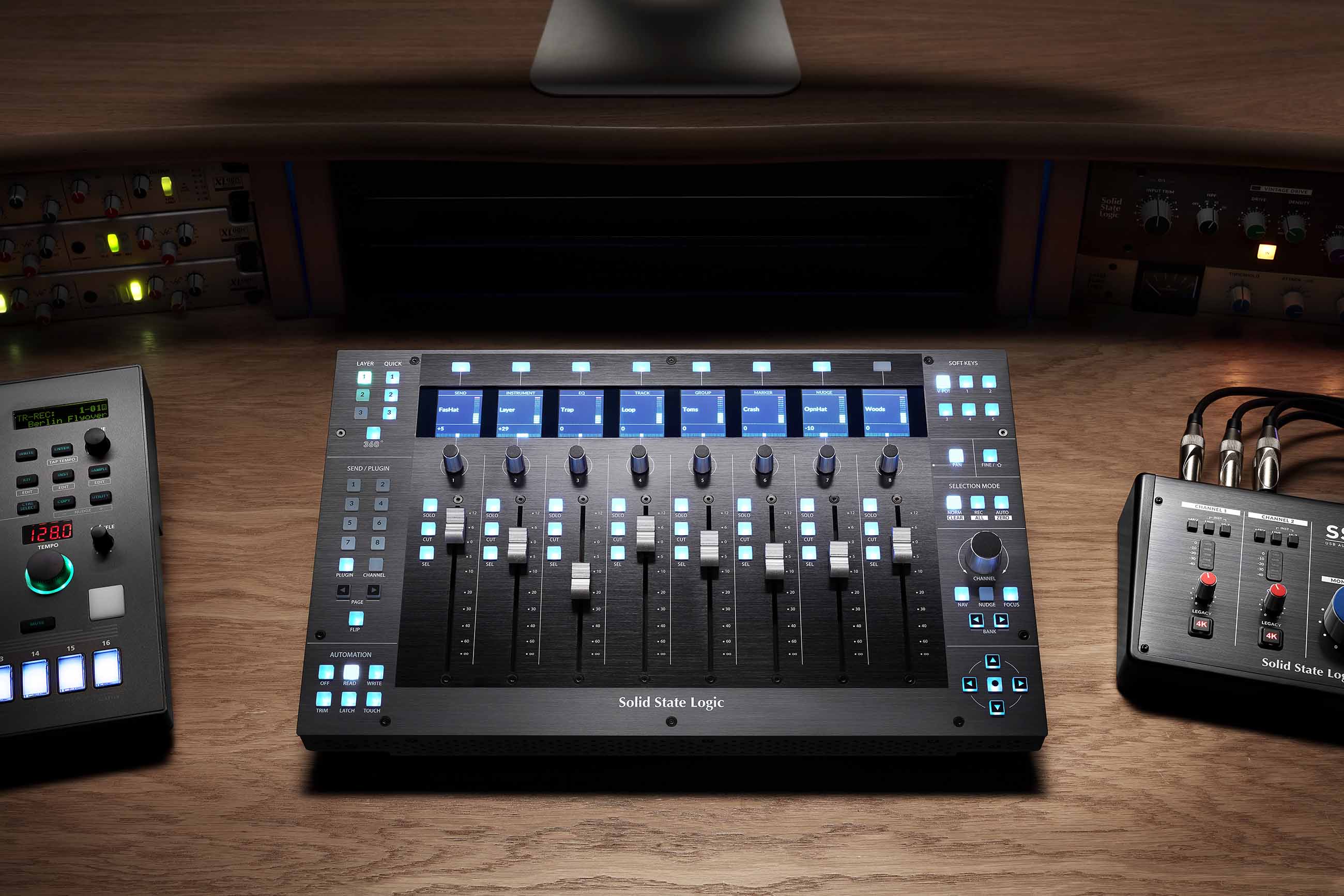 Solid State Logic UF8 Advanced DAW Controller, showing its sleek control surface with eight motorized, touch-sensitive faders, eight high-resolution LCD TFT displays, and numerous RGB backlit soft-touch buttons and rotary encoders.